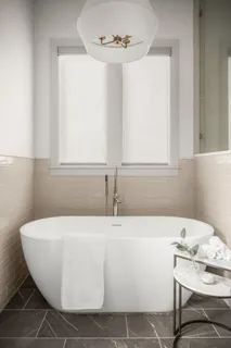 a view of swimming pool with chairs and umbrella