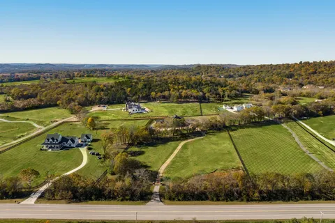 a view of a swimming pool with a yard