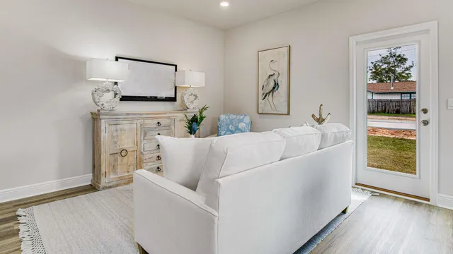 a living room with furniture and a window