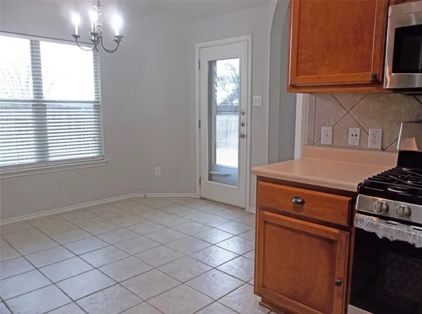 a kitchen with a stove and a microwave