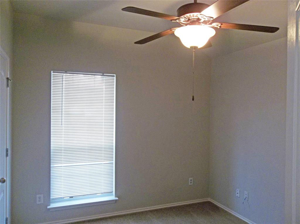 110 Fossil Trail Leander, TX 78641 - Photo 10 of 12 a small space with a window and a fan