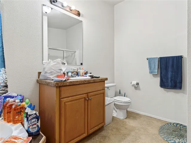 a bathroom with a sink toilet and vanity