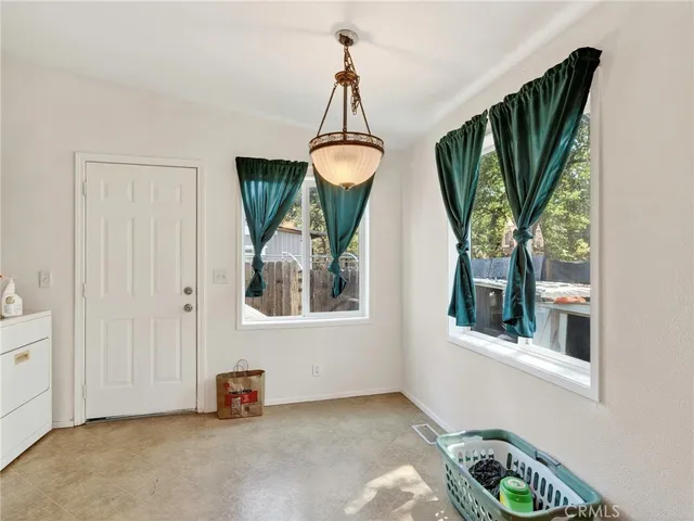 a view of a livingroom with furniture and windows
