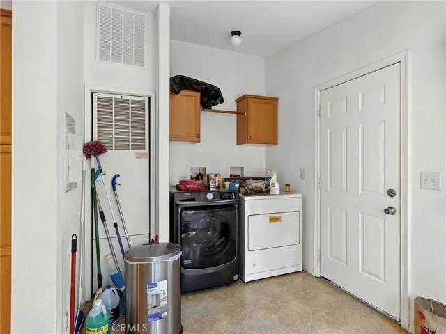 a storage room with washer and dryer