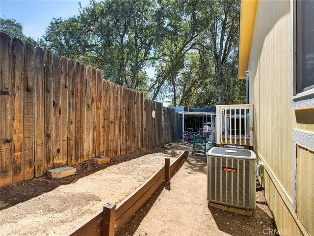 a view of balcony with furniture and wooden fence