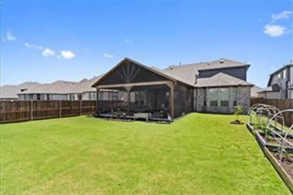 a view of a house with swimming pool and porch