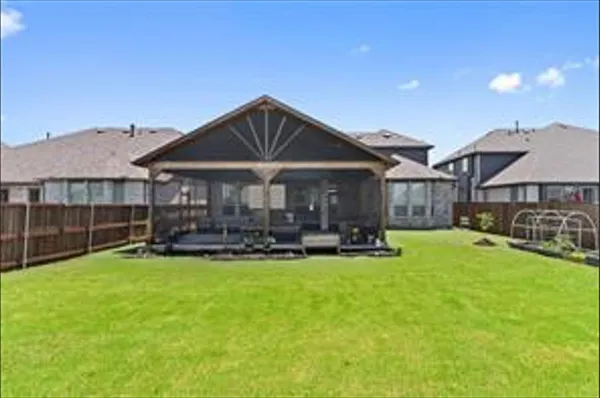 a front view of a house with swimming pool having outdoor seating