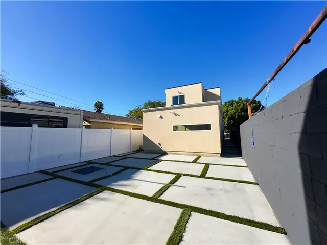 a view of a backyard with sitting area