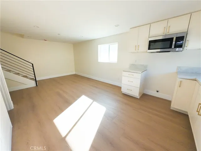 a view of a livingroom with furniture and a flat screen tv