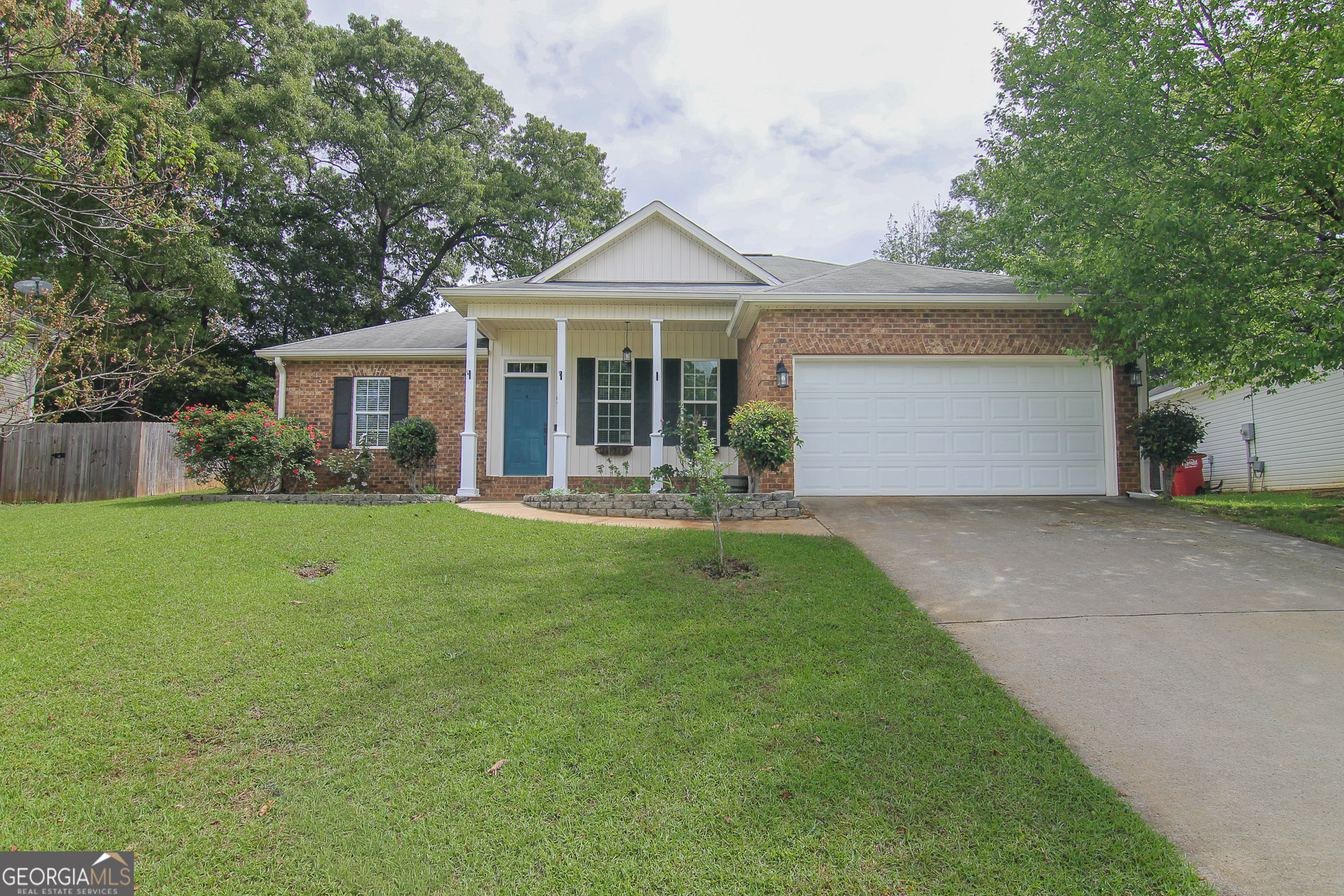 105 Jeanette Place Centerville, GA 31028 - Photo 1 of 1 a front view of a house with garden