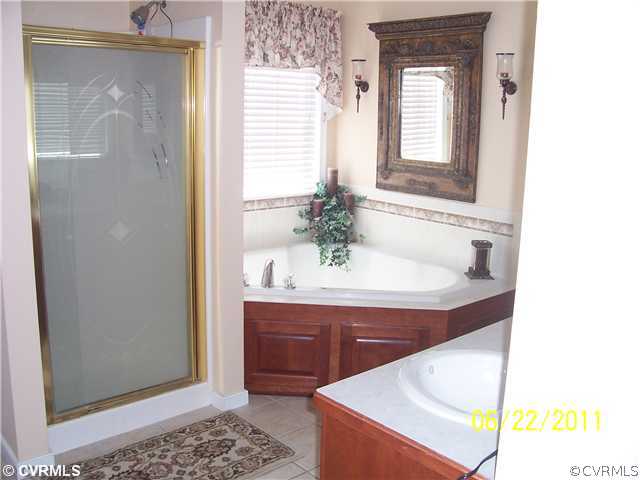 3307 Whitehouse Road Colonial Heights, VA 23834 - Photo 4 of 12 a bathroom with a sink and a mirror
