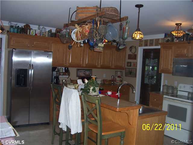 3307 Whitehouse Road Colonial Heights, VA 23834 - Photo 6 of 12 a view of a dining room with furniture and chandelier