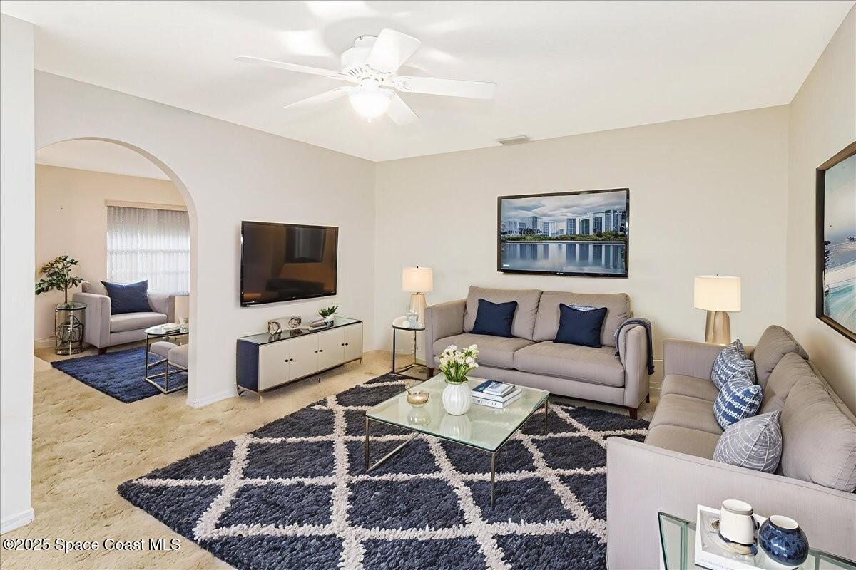 948 Pelican Lane Rockledge, FL 32955 - Photo 15 of 38 a living room with furniture and a flat screen tv