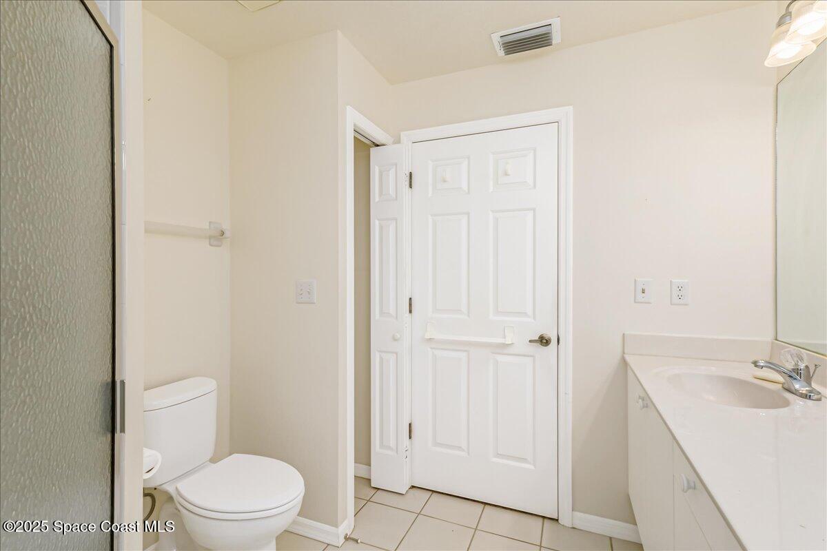 948 Pelican Lane Rockledge, FL 32955 - Photo 24 of 38 a bathroom with a sink a toilet and shower