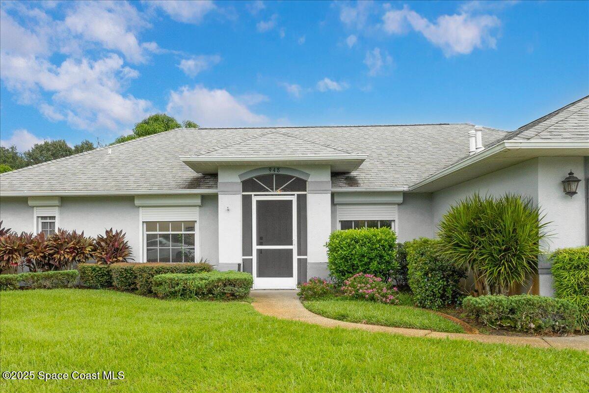 948 Pelican Lane Rockledge, FL 32955 - Photo 5 of 38 a front view of a house with garden