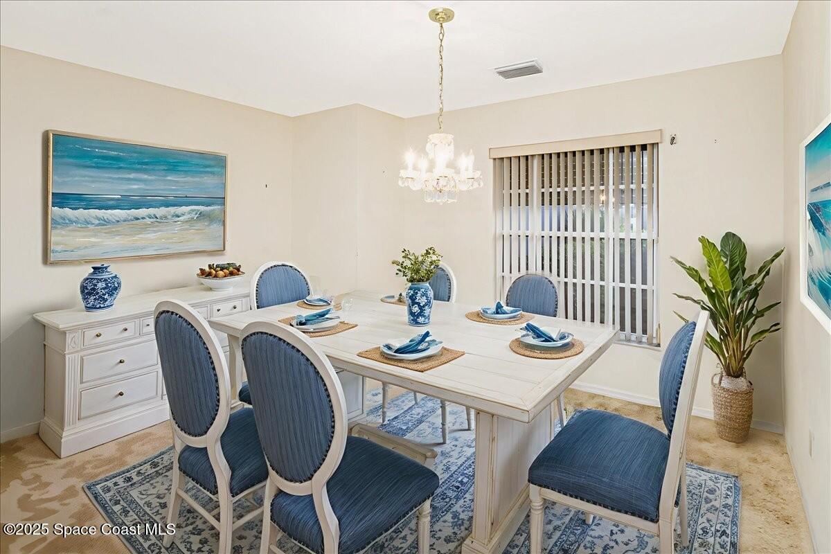 948 Pelican Lane Rockledge, FL 32955 - Photo 8 of 38 a view of a dining room with furniture window and wooden floor