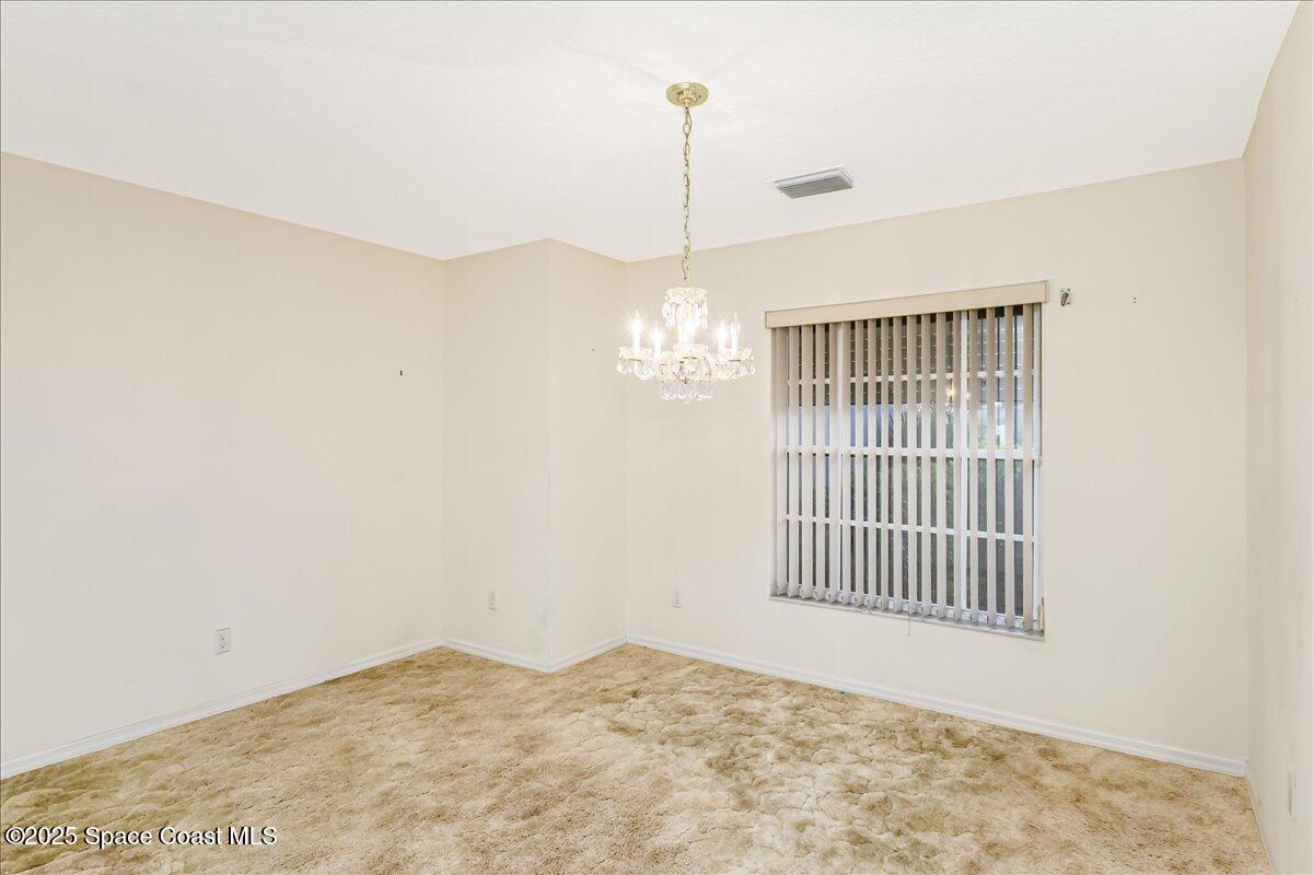 948 Pelican Lane Rockledge, FL 32955 - Photo 9 of 38 a view of an empty room with windows