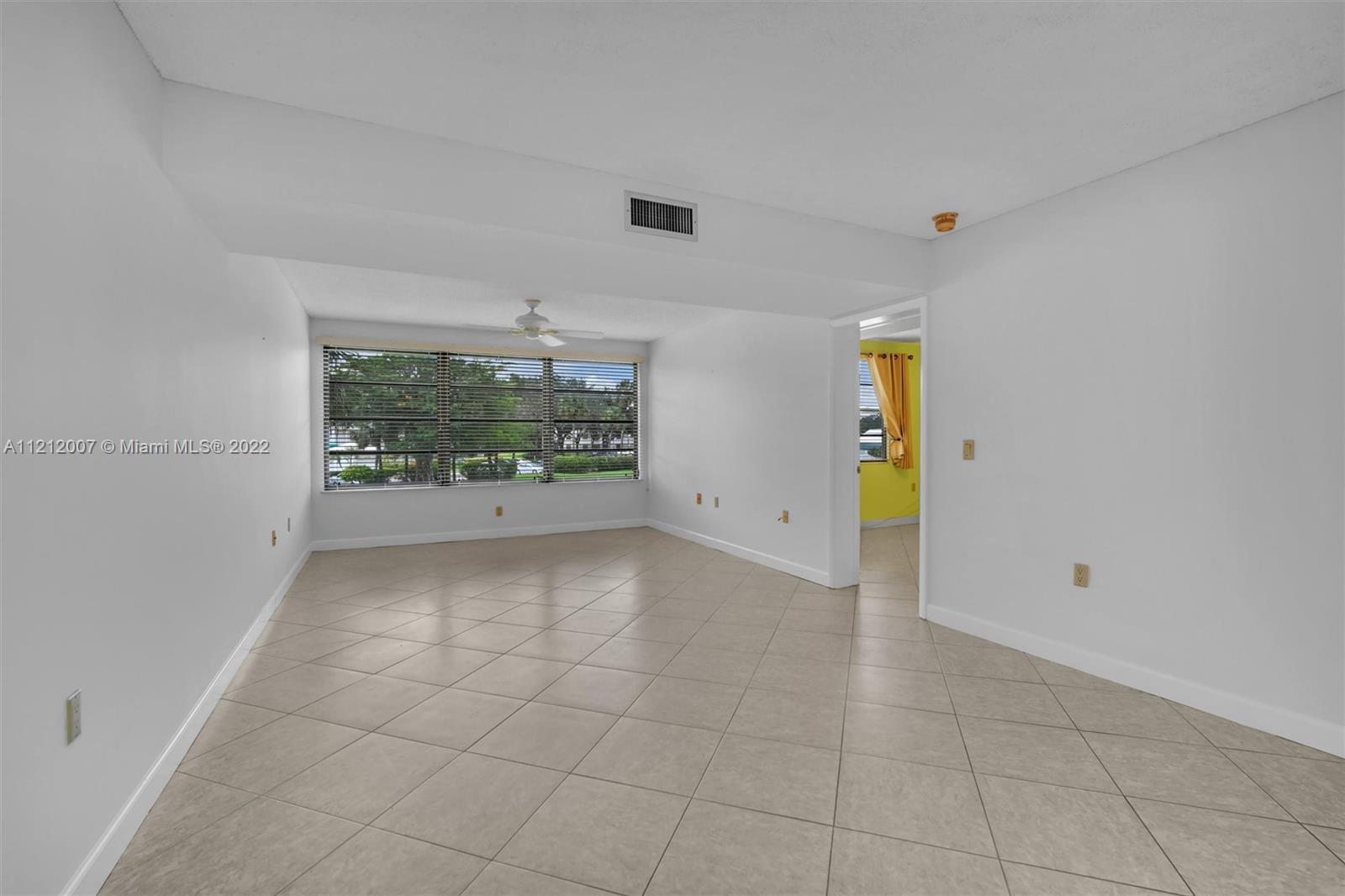 6025 Balboa Circle, Unit 202 Boca Raton, FL 33433 - Photo 16 of 28 an empty room with windows