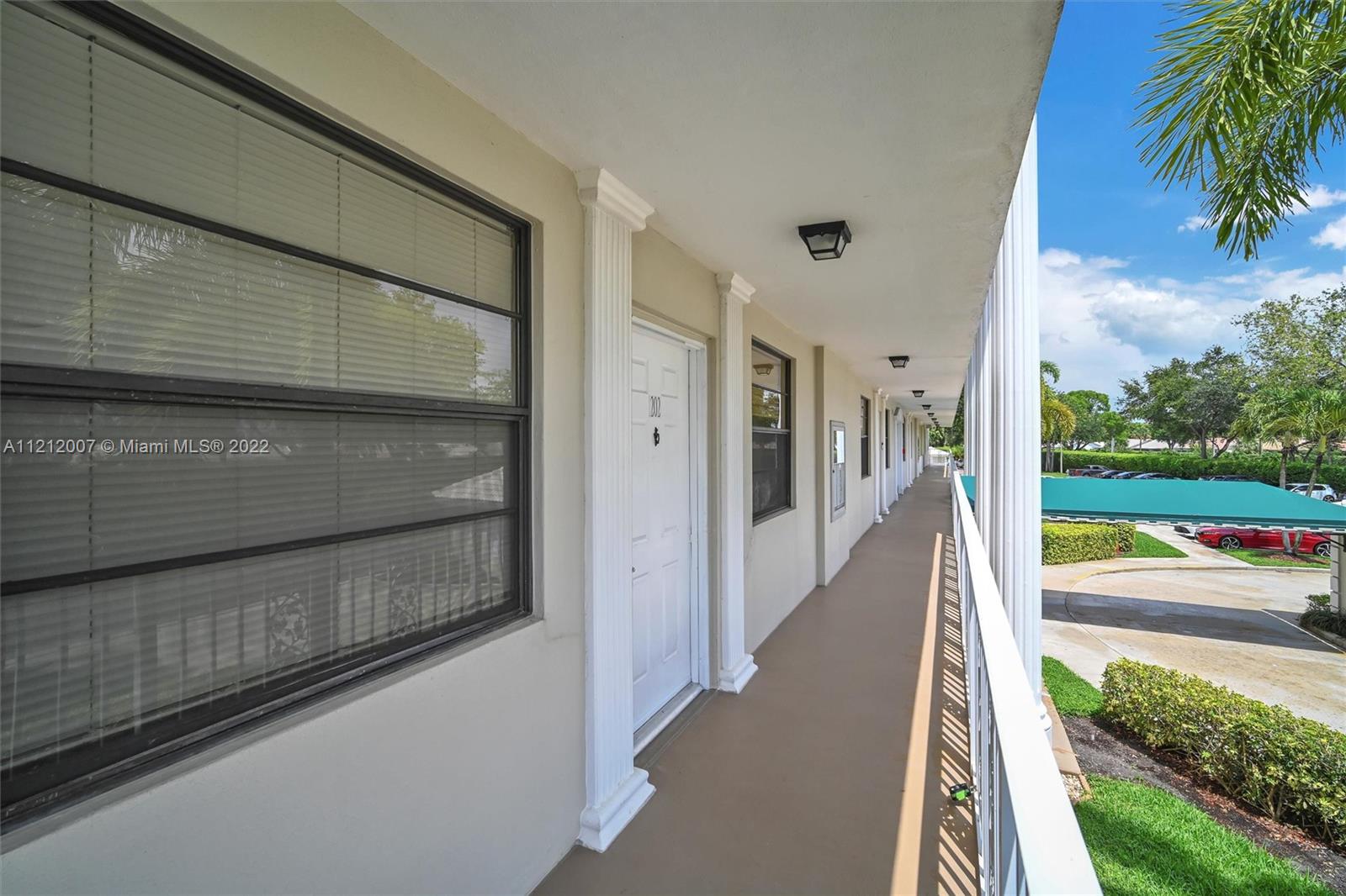 6025 Balboa Circle, Unit 202 Boca Raton, FL 33433 - Photo 5 of 28 a view of a entrance door of the house