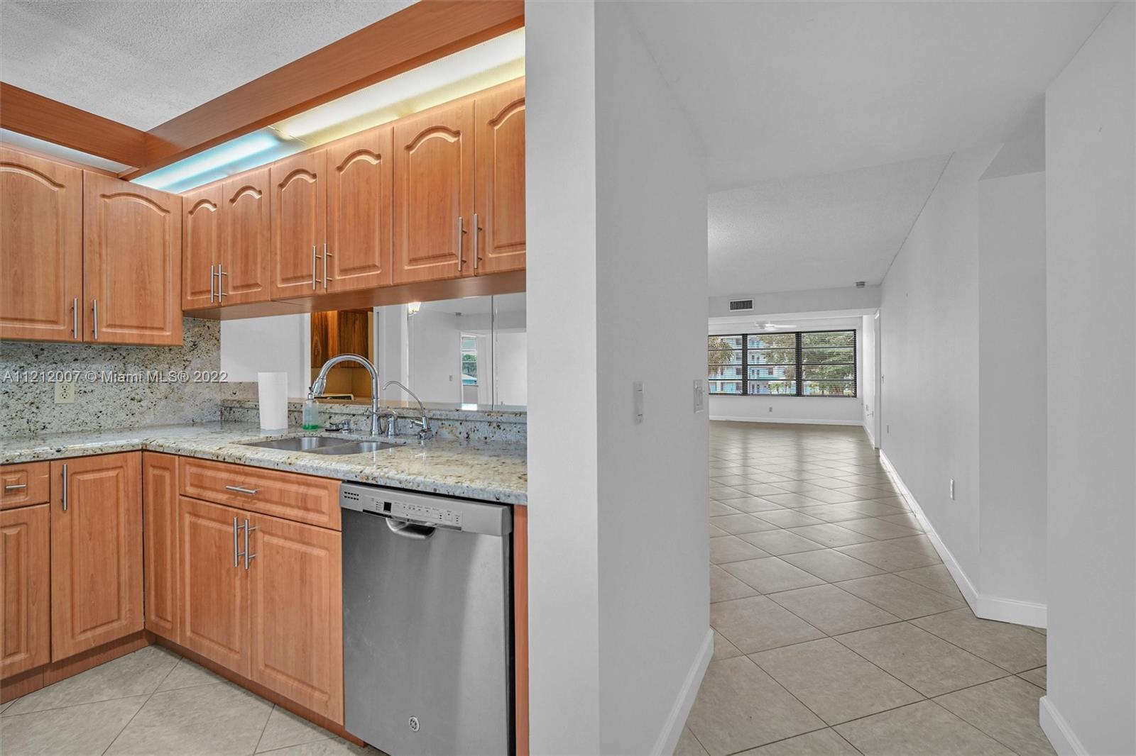 6025 Balboa Circle, Unit 202 Boca Raton, FL 33433 - Photo 6 of 28 a kitchen with a sink a cabinets and window