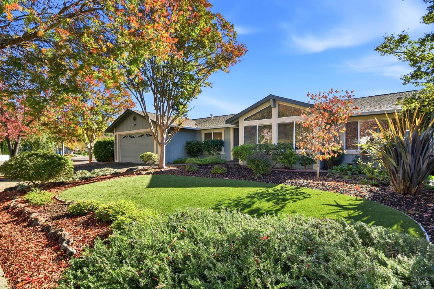 a front view of a house with swimming pool having outdoor seating