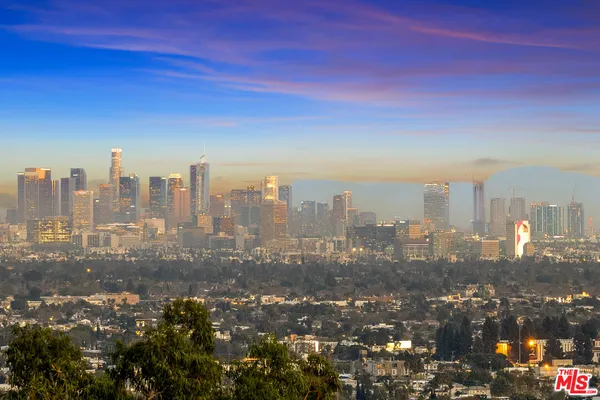 a view of a city with tall buildings