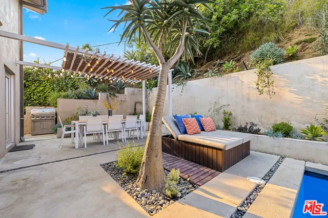 a view of a backyard with sitting area