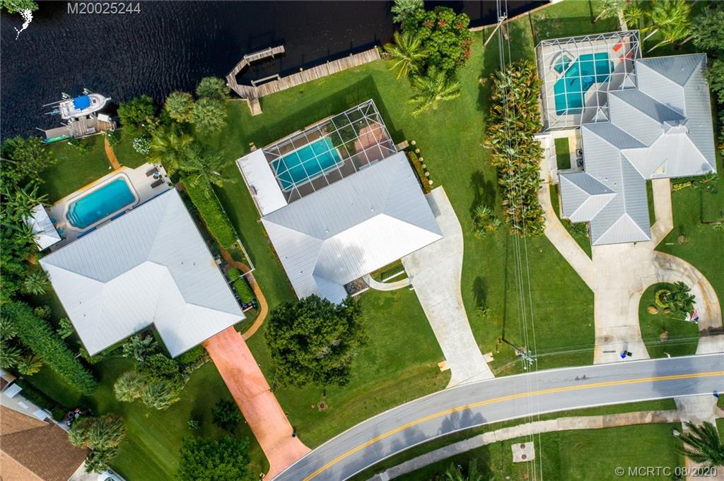 1194 Northwest Spruce Ridge Drive Stuart, FL 34994 - Photo 7 of 34 an aerial view of a house