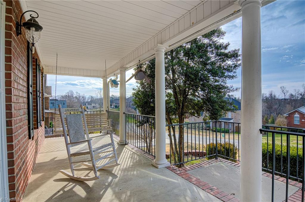 473 Beech Ridge Road Thomasville, NC 27360 - Photo 3 of 34 Sit on your rocking chair and enjoy the front porch.