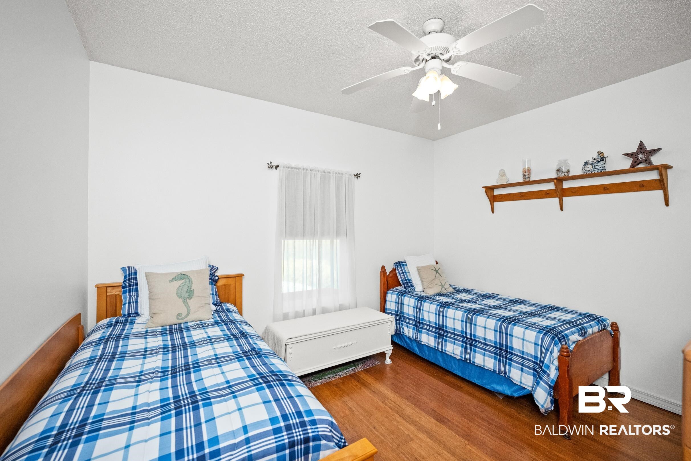 22355 East County Road 12 Foley, AL 36535 - Photo 38 of 54 Bedroom with wood finished floors, a ceiling fan, and a textured ceiling