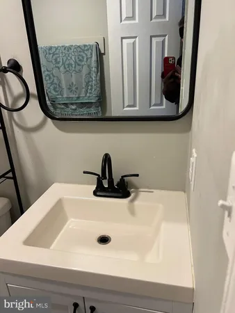 a bedroom with a bed and a desk