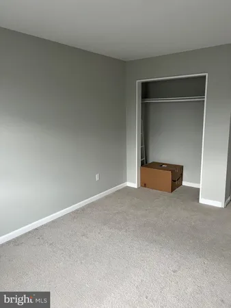 a bedroom with a bed and a table