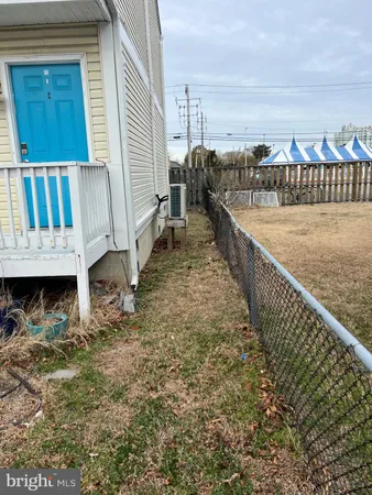 a view of a backyard with sitting area