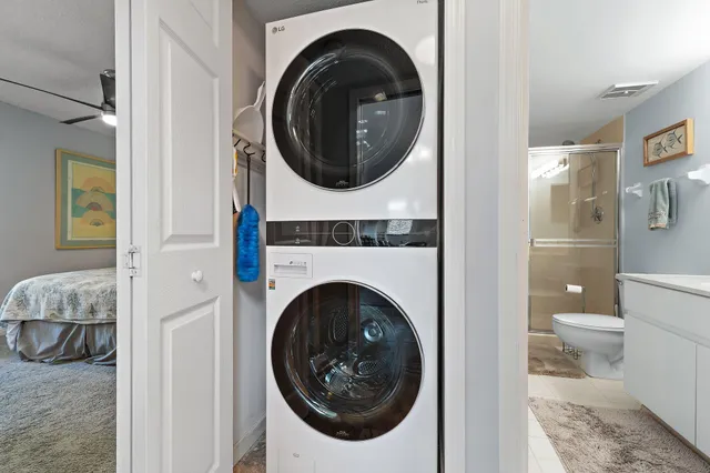 a bedroom with a bed and a television