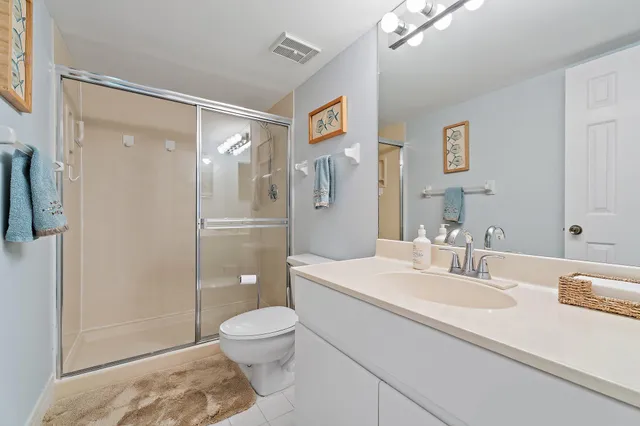 an aerial view of a house with a yard and pool