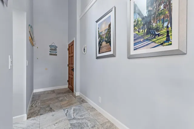 a kitchen with stainless steel appliances granite countertop a sink and a refrigerator