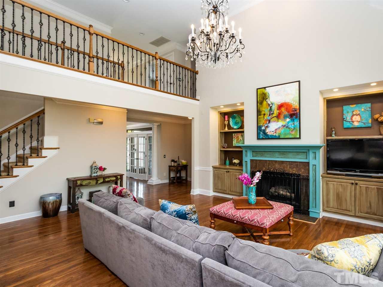 12423 Canolder Street Raleigh, NC 27614 - Photo 5 of 25 2 Story Family Room with Gas Fireplace and Built-in Bookcases