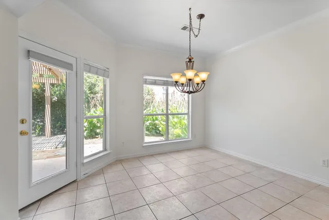 a view of an empty room with windows