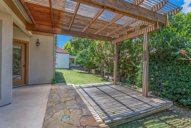 a view of a backyard with wooden floor