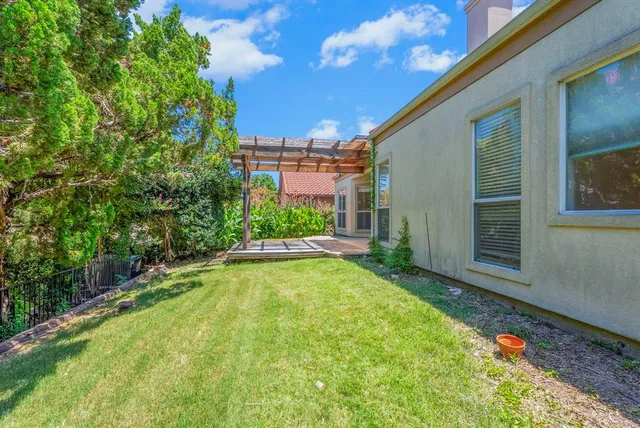 a view of swimming pool with outdoor seating and plants