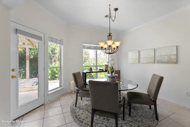 a view of a dining room with furniture window and outside view