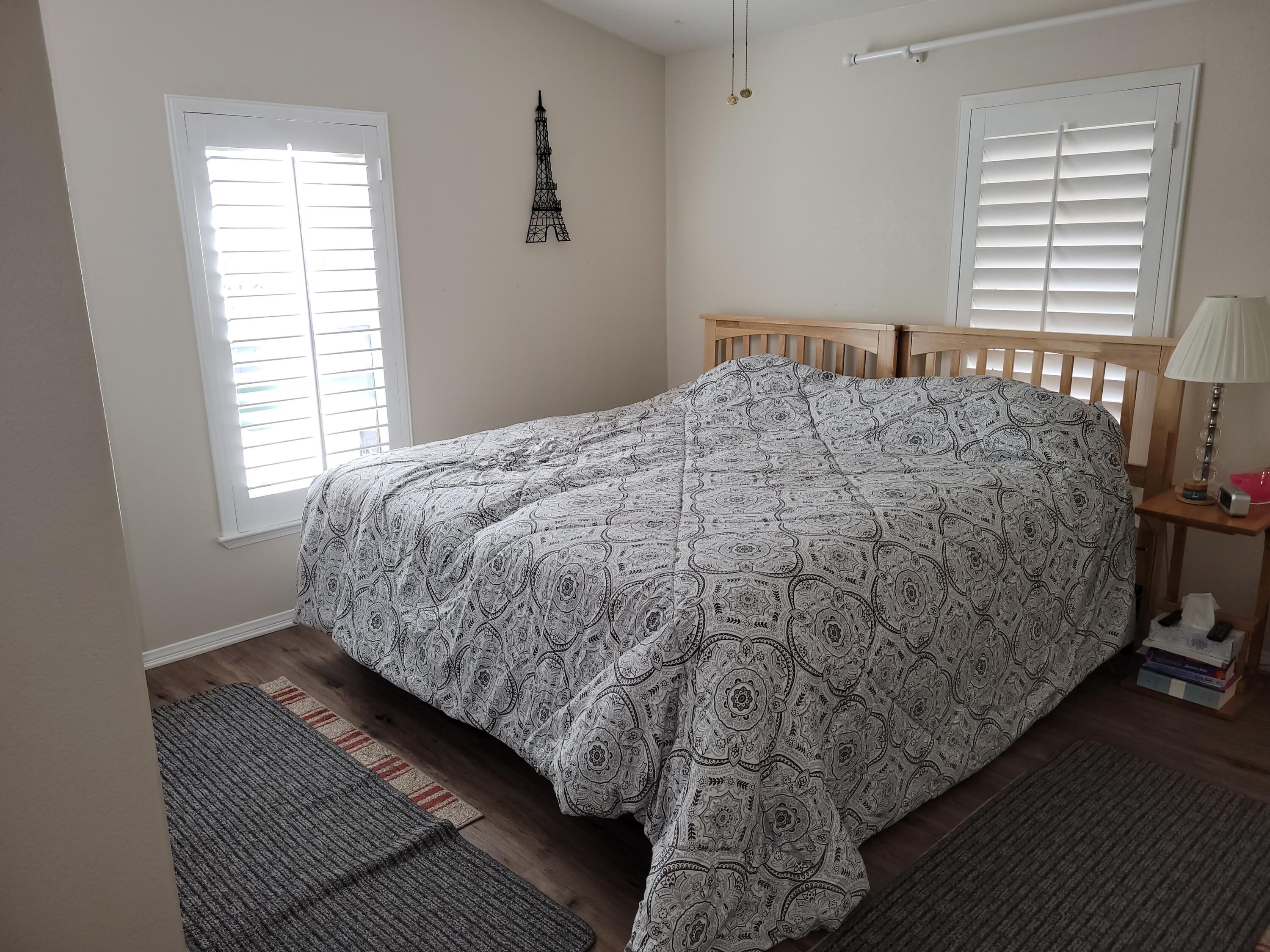 81641 Ave 48, Unit 56 Indio, CA 92201 - Photo 15 of 28 a bed sitting in a bedroom next to a window