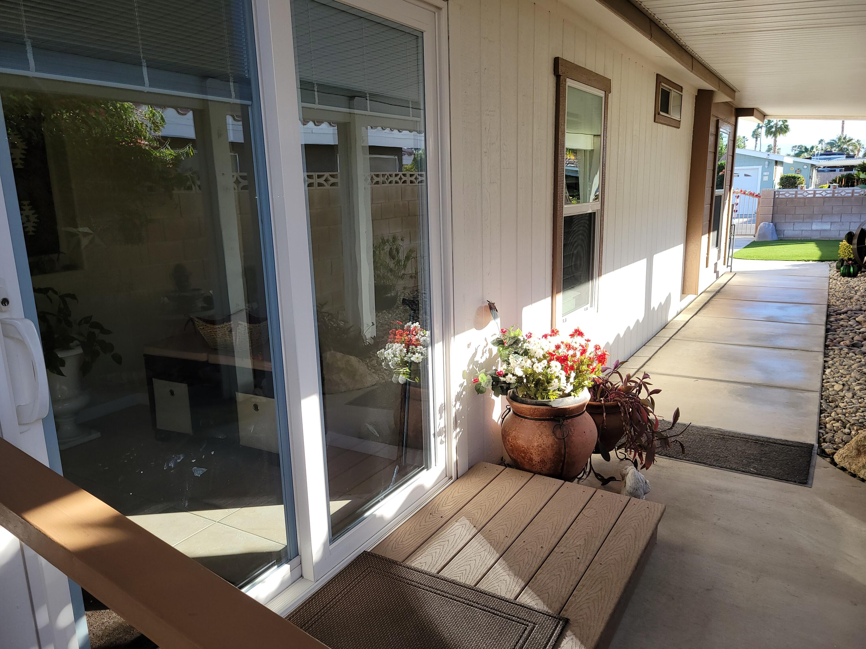 81641 Ave 48, Unit 56 Indio, CA 92201 - Photo 17 of 28 a view of a porch with dining area