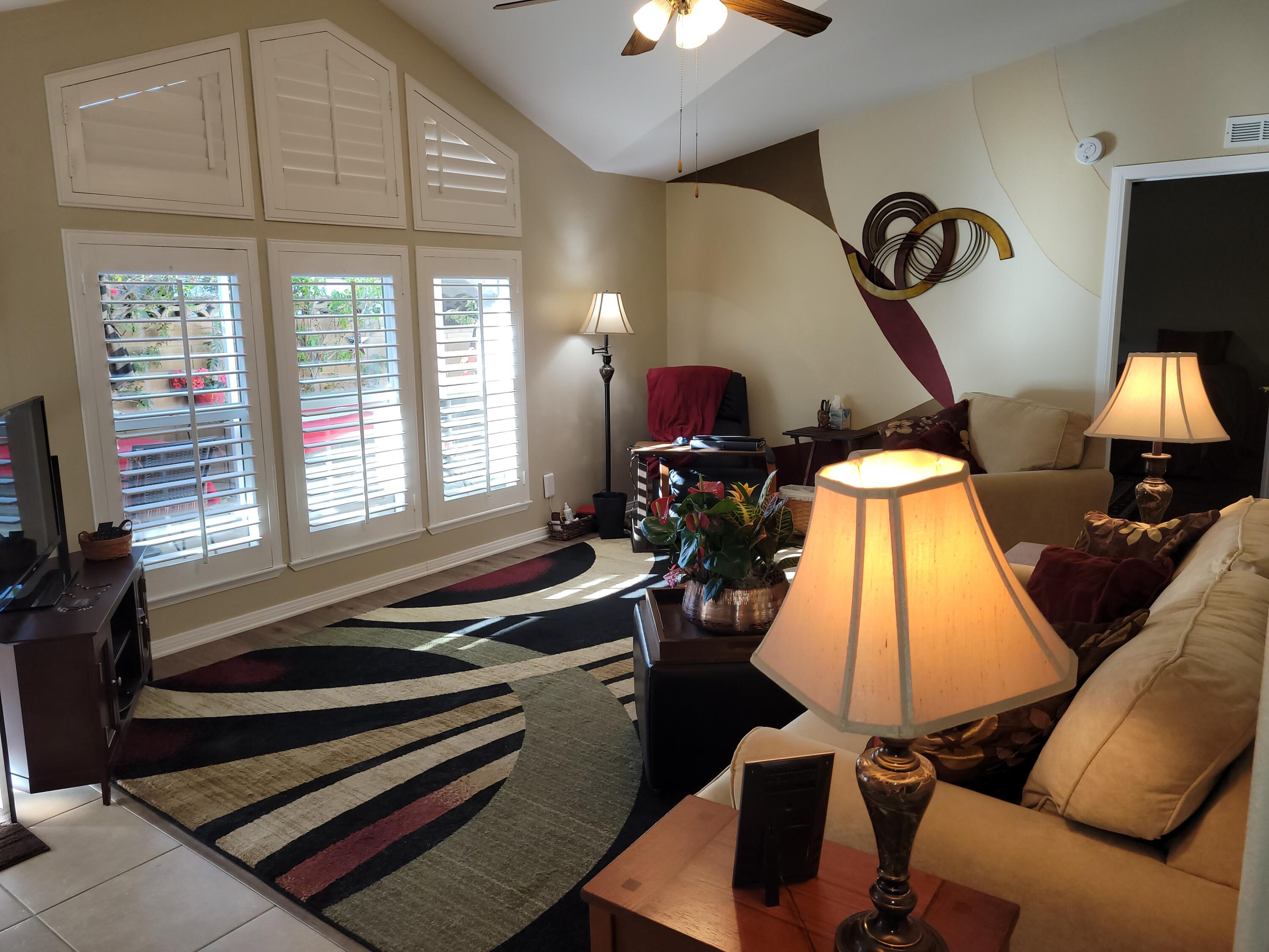 81641 Ave 48, Unit 56 Indio, CA 92201 - Photo 2 of 28 a room with gym equipment and a large window