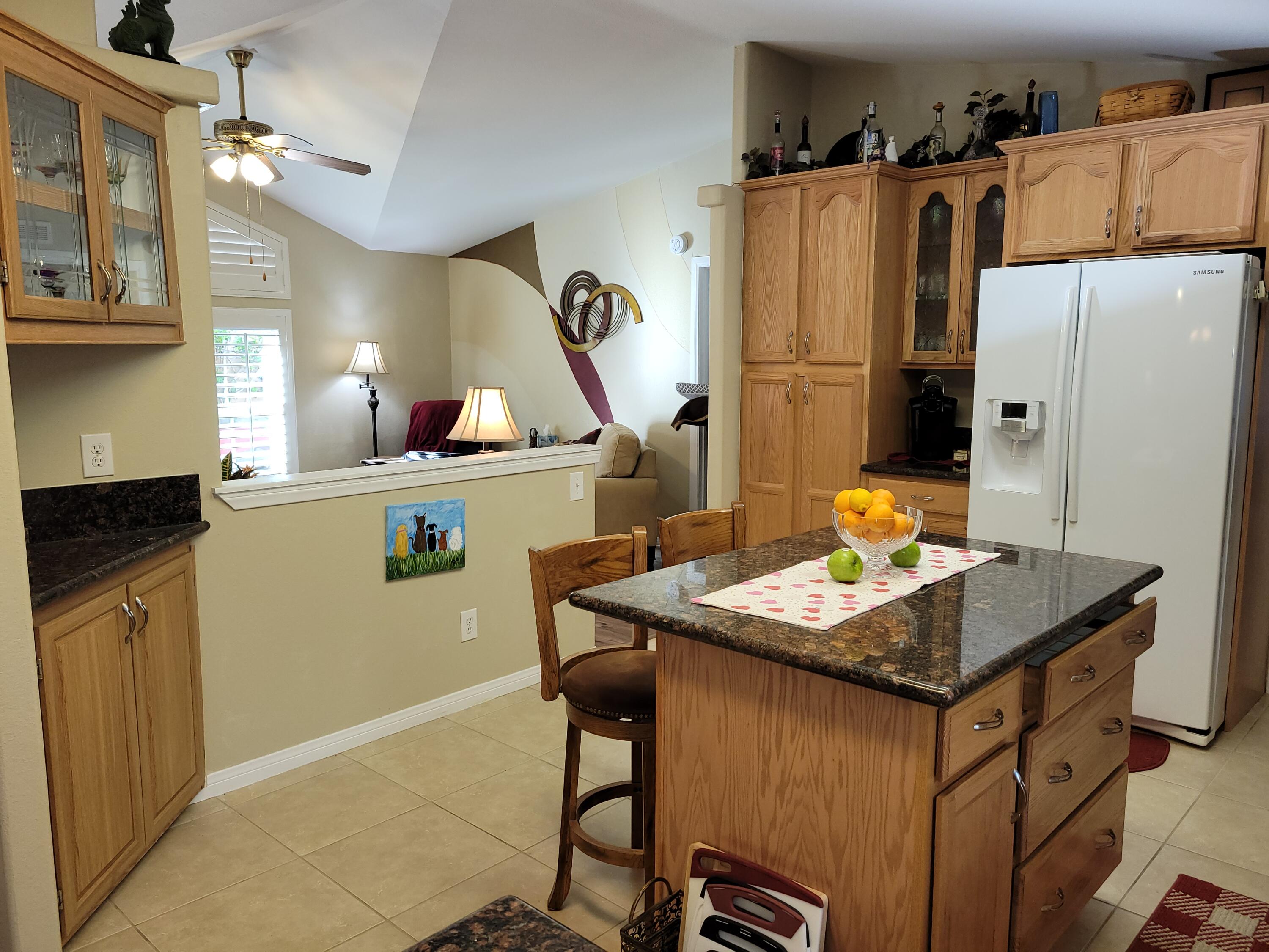 81641 Ave 48, Unit 56 Indio, CA 92201 - Photo 5 of 28 a kitchen with sink cabinets and refrigerator