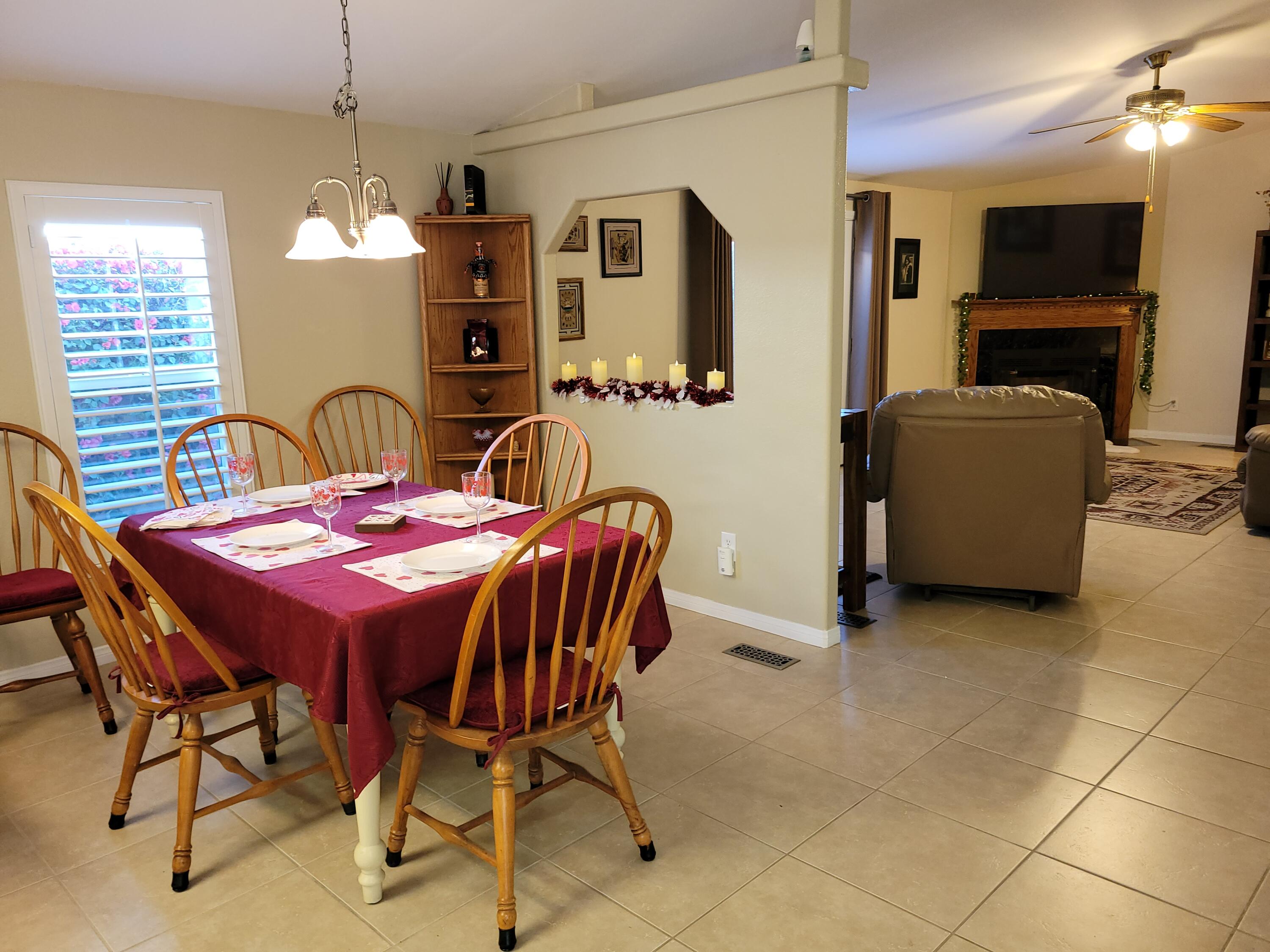 81641 Ave 48, Unit 56 Indio, CA 92201 - Photo 6 of 28 a view of a dining room with furniture
