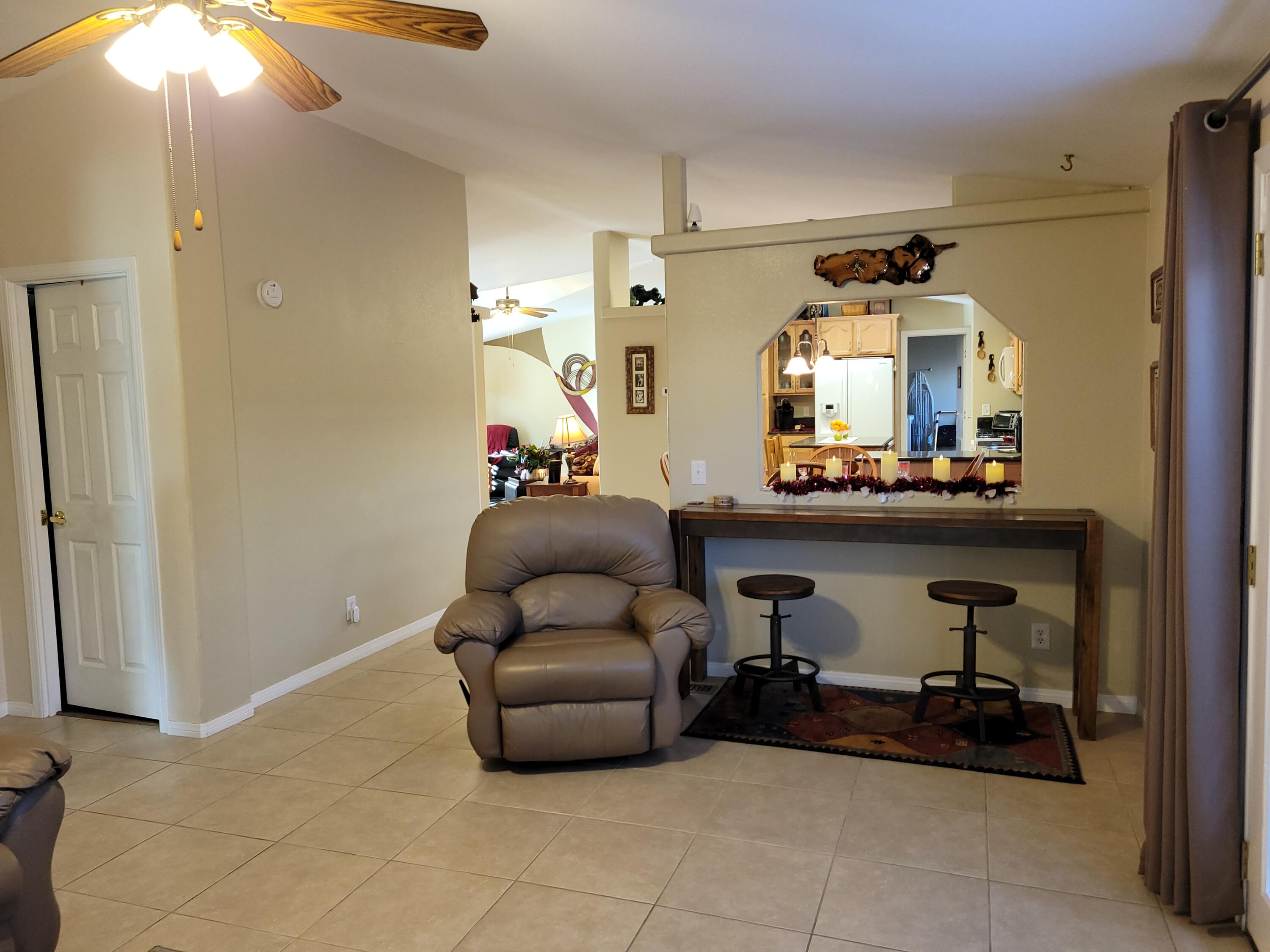 81641 Ave 48, Unit 56 Indio, CA 92201 - Photo 8 of 28 a living room with furniture and a mirror