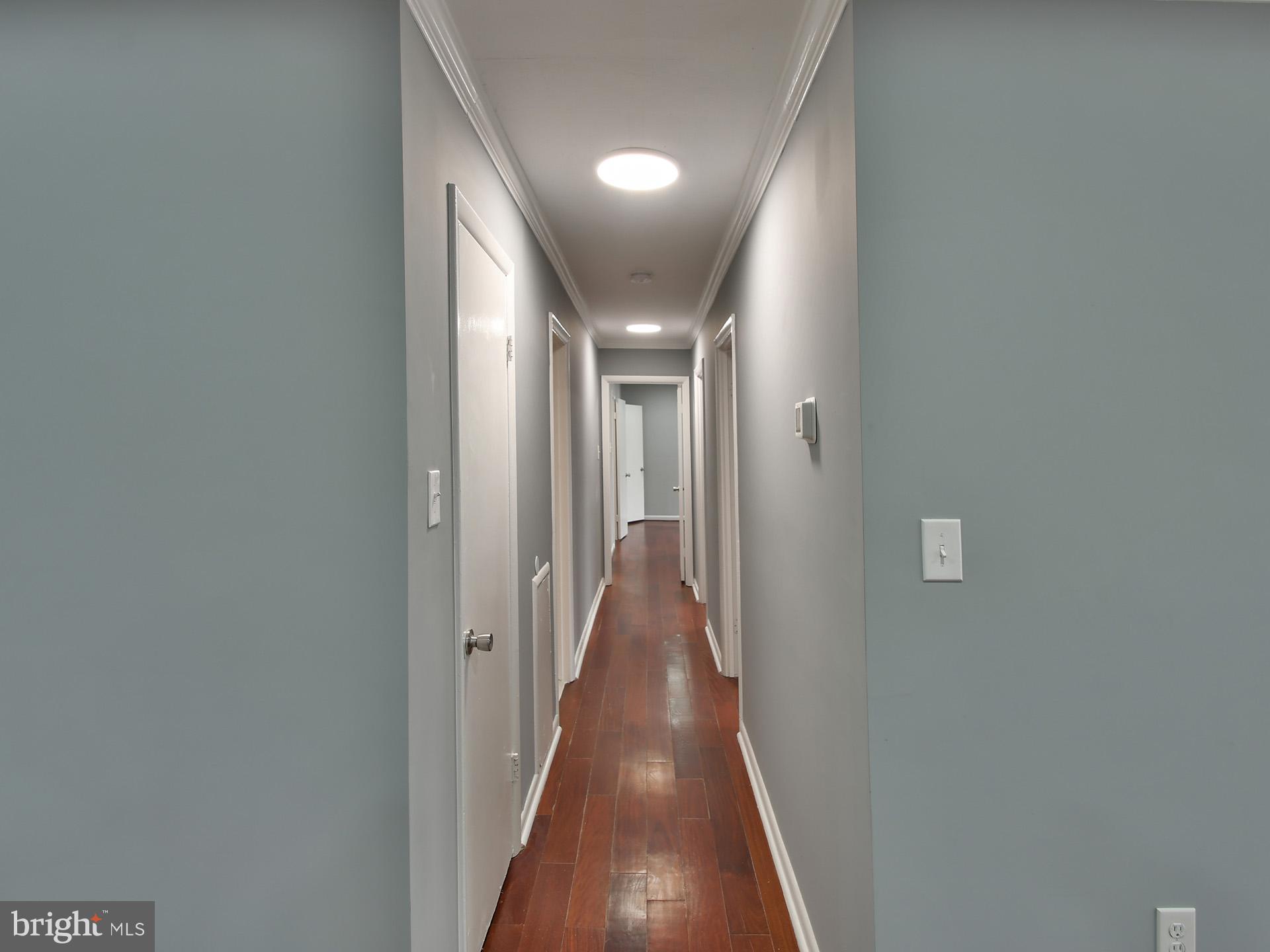15712 Dorset Road, Unit 104 Laurel, MD 20707 - Photo 21 of 49 a view of a hallway with wooden floor
