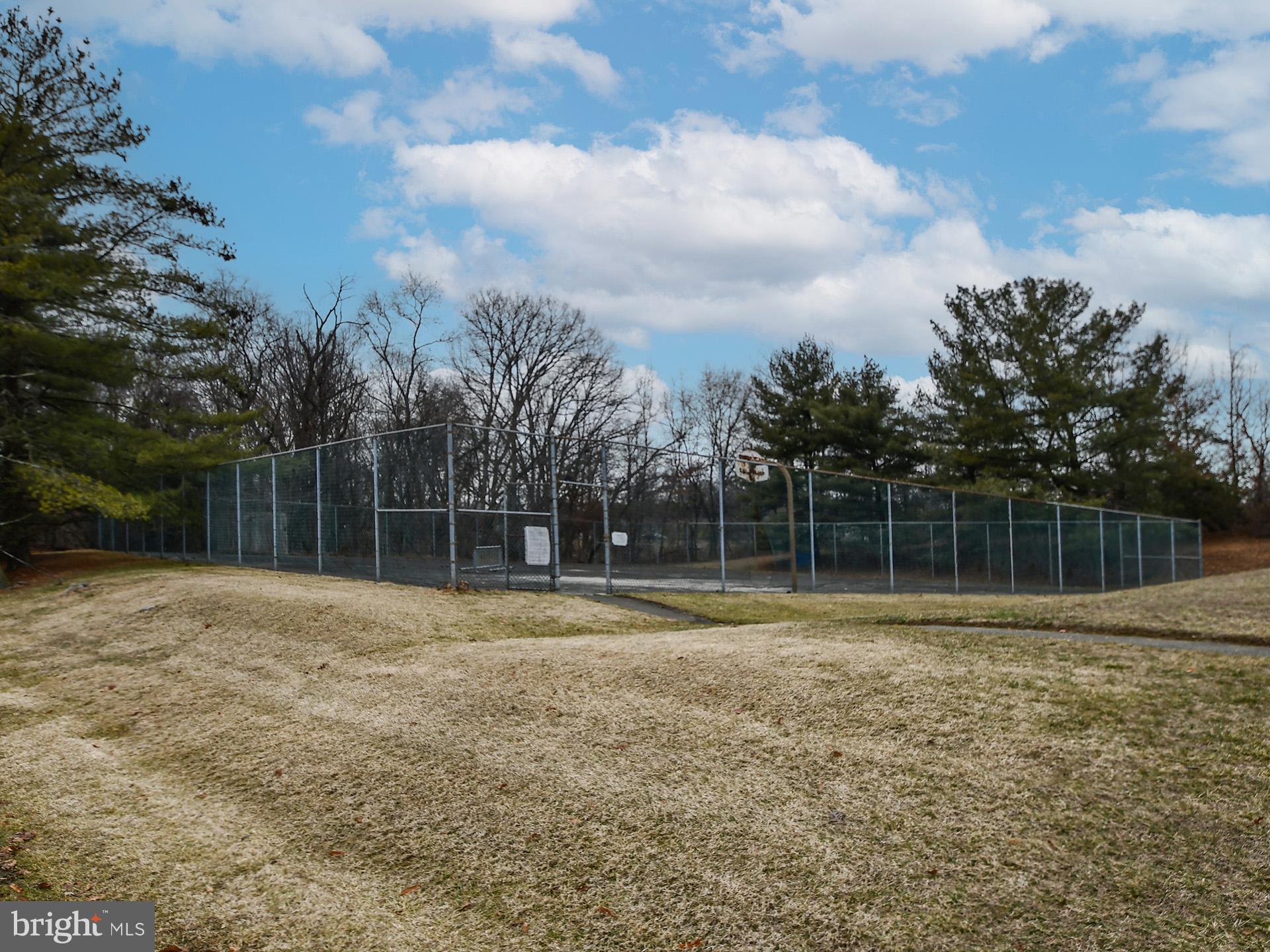 15712 Dorset Road, Unit 104 Laurel, MD 20707 - Photo 43 of 49 a backyard of a house with lots of green space