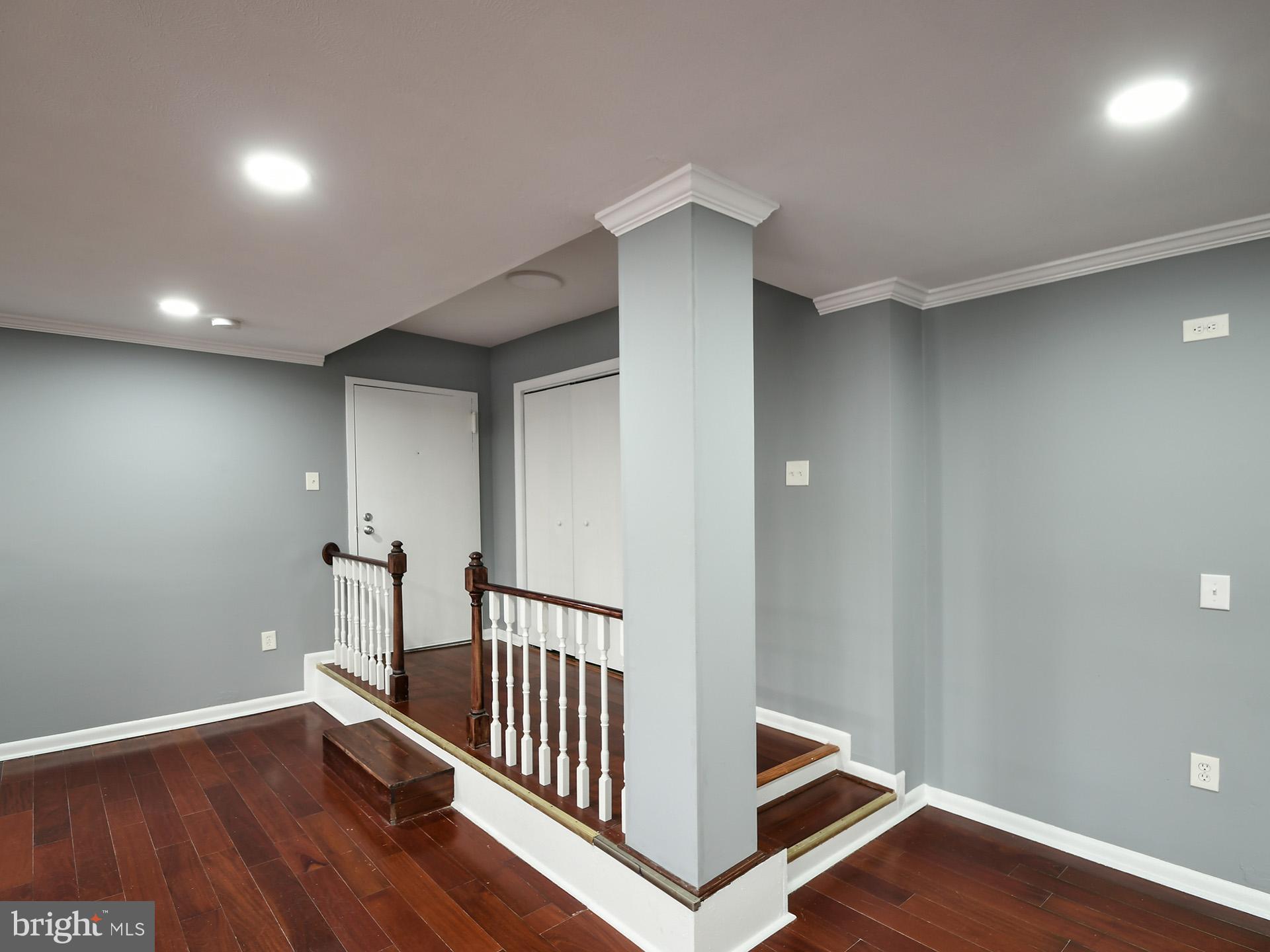 15712 Dorset Road, Unit 104 Laurel, MD 20707 - Photo 6 of 49 a view of hallway with wooden floor
